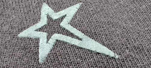 A close-up of a t-shirt featuring a starry night print.