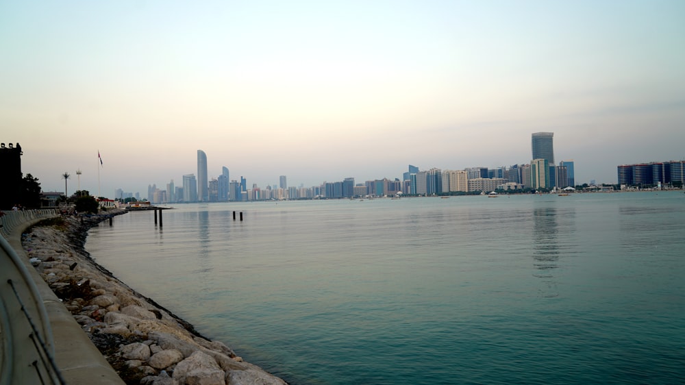 body of water near city buildings during daytime