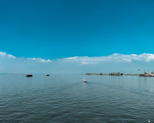 people riding on boat on sea during daytime in Alappuzha India