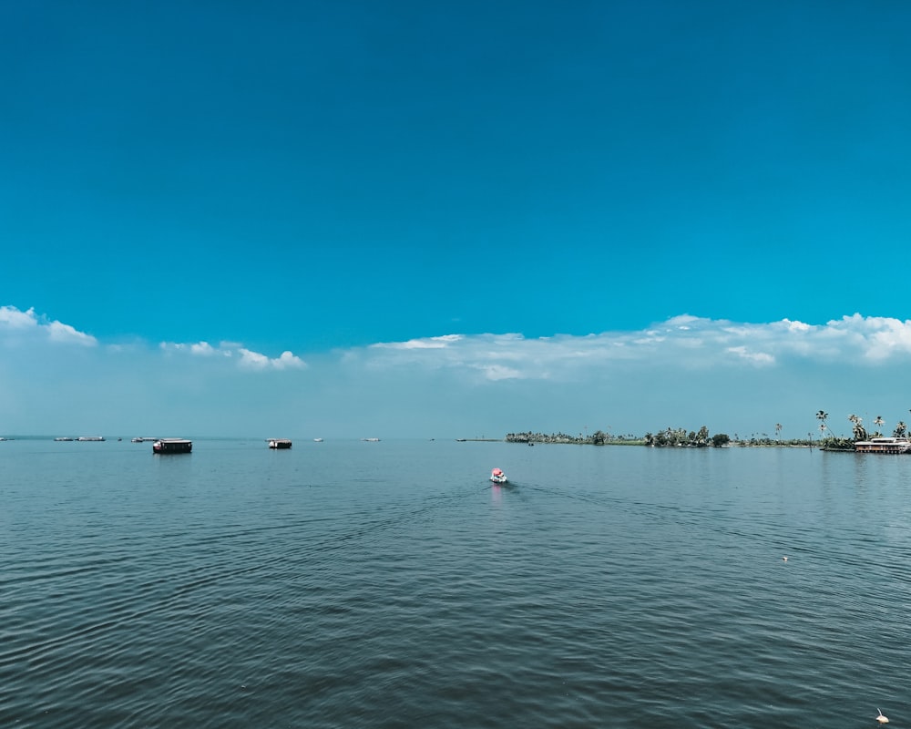 people riding on boat on sea during daytime