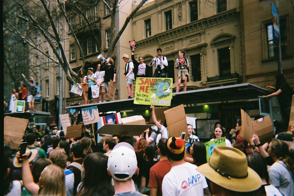 people in white shirts and cowboy hat standing on street during daytime