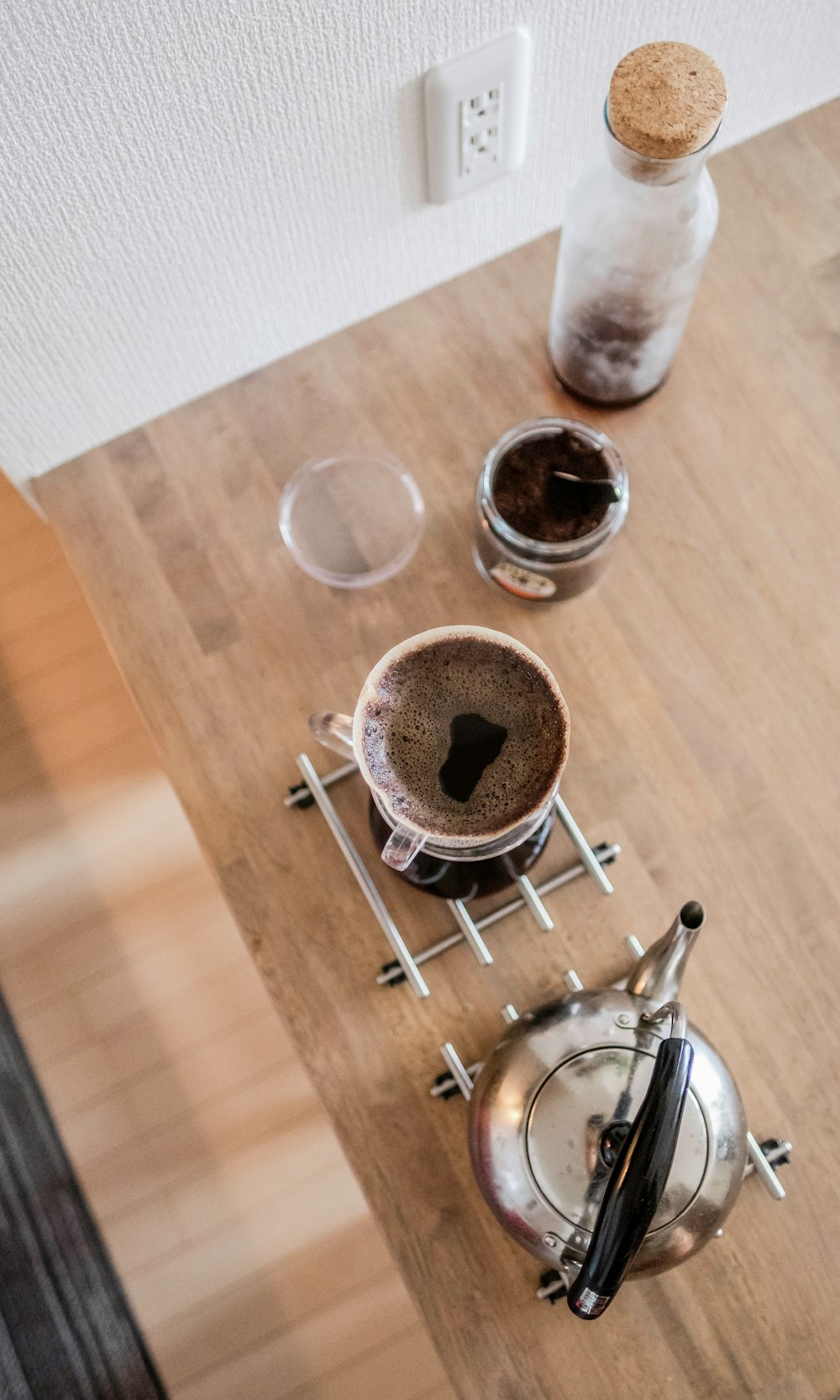 white ceramic mug on brown wooden table