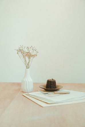 Close-up of minimalist centerpiece with delicate beige and pastel elements.