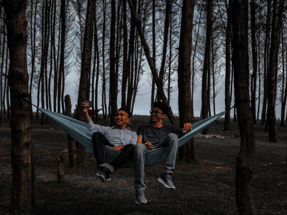 couple sitting on blue hammock