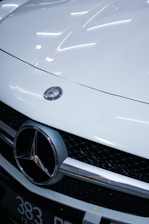 white mercedes benz car with license plate