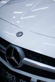 white mercedes benz car with license plate
