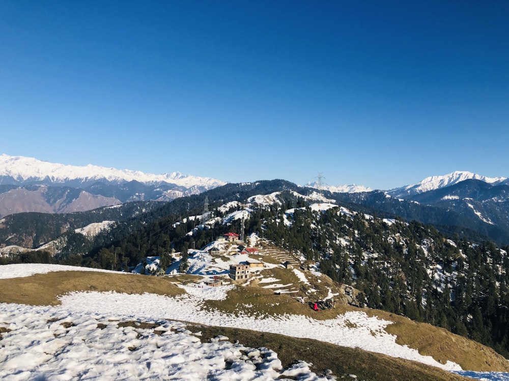 people on snow covered mountain during daytime