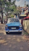 The car parked near a famous Odisha temple under a bright blue sky.