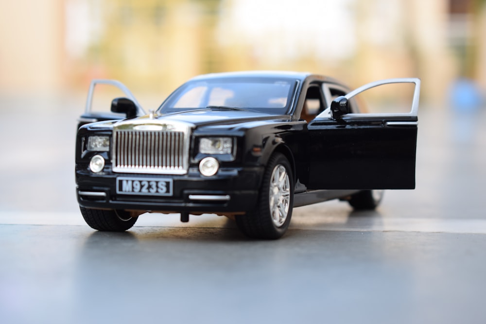 black classic car on road during daytime