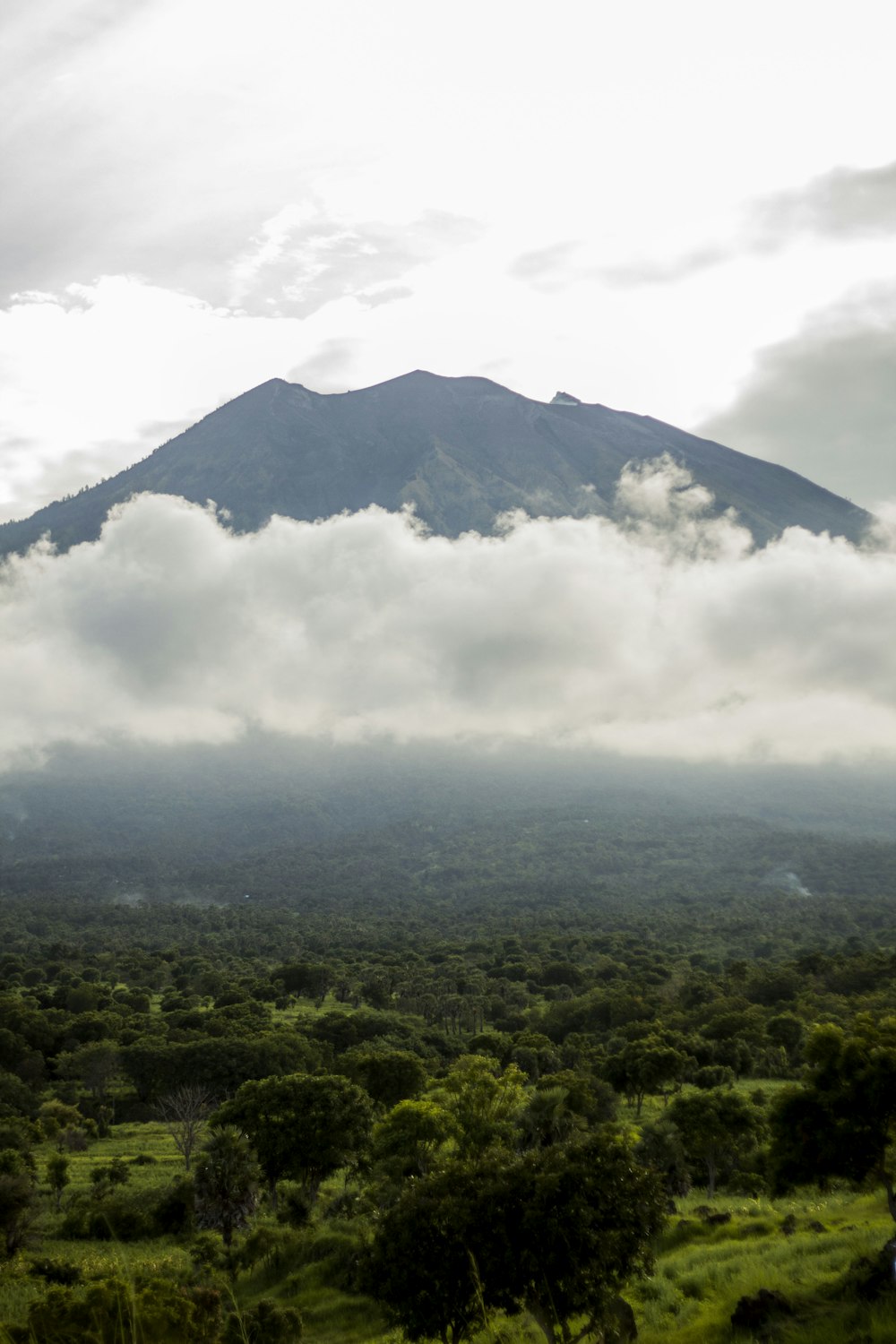 green mountain under white clouds during daytime