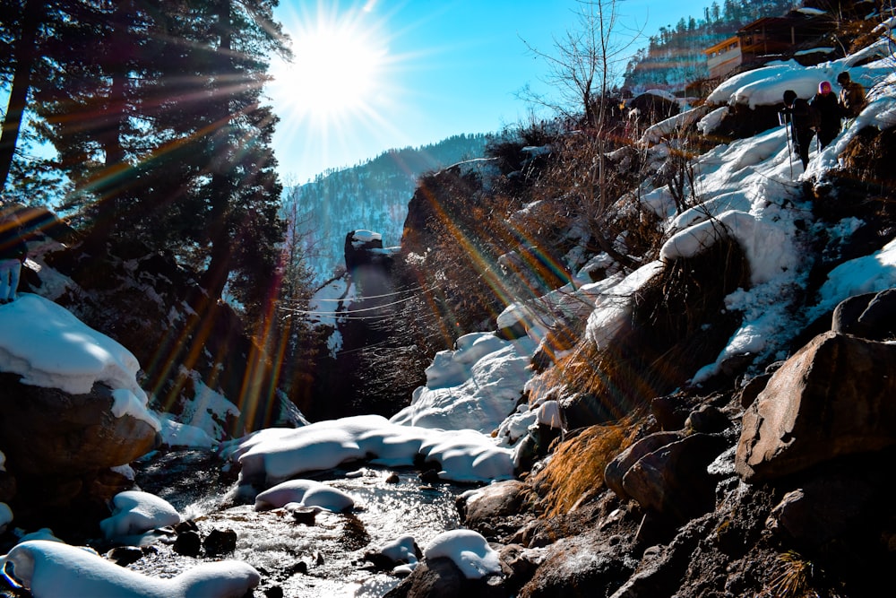 person in black jacket standing on rocky road during daytime