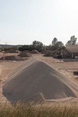 brown sand near brown concrete building during daytime