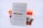 A stack of books with 'Thinking, Fast and Slow' by Daniel Kahneman prominently displayed in the foreground. The cover features a simple design with a pencil graphic. Other books in the stack include brightly colored covers adding a pop of color to the scene.