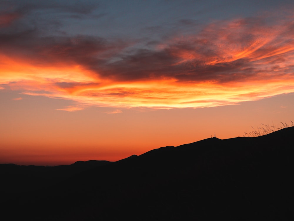 silhouette of mountain during sunset