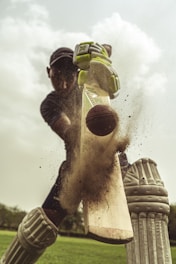 Saifullah Ghauri practicing cricket at Ghani Institute, wearing cricket gear and focused on the ball.