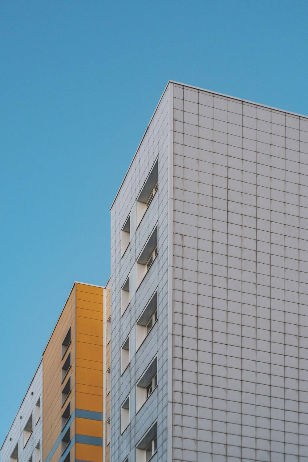 white concrete building under blue sky during daytime