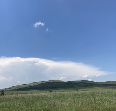 A beautiful landscape of fields under a clear blue sky.