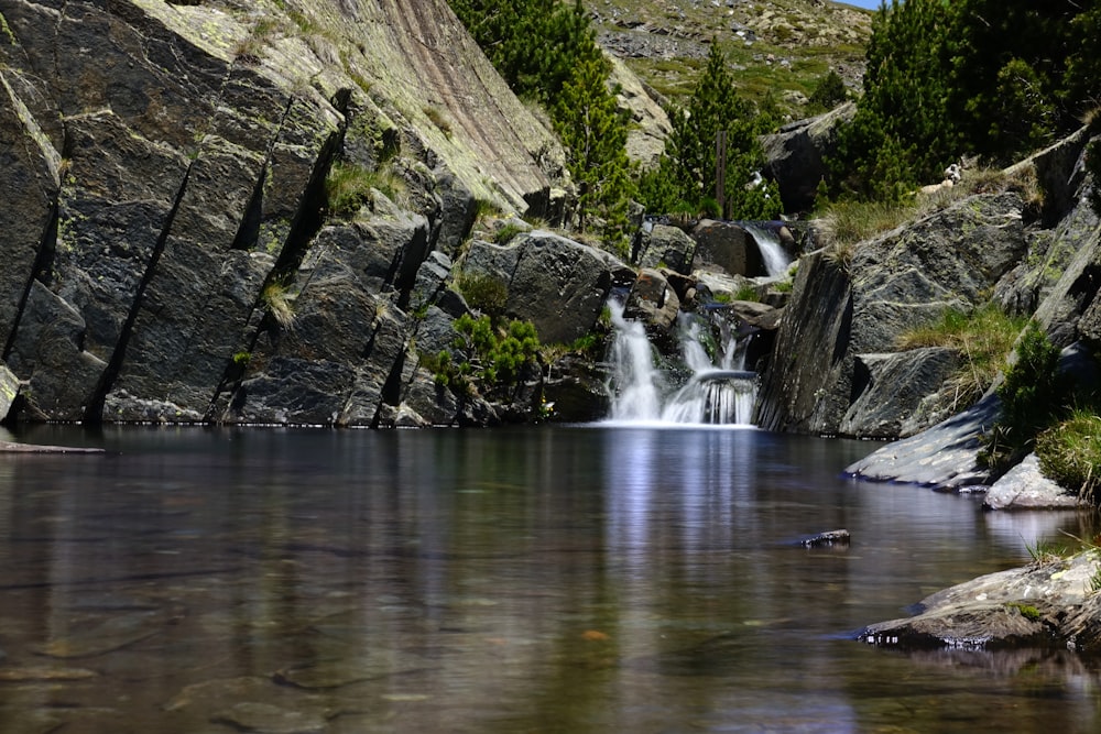 water falls on rocky mountain