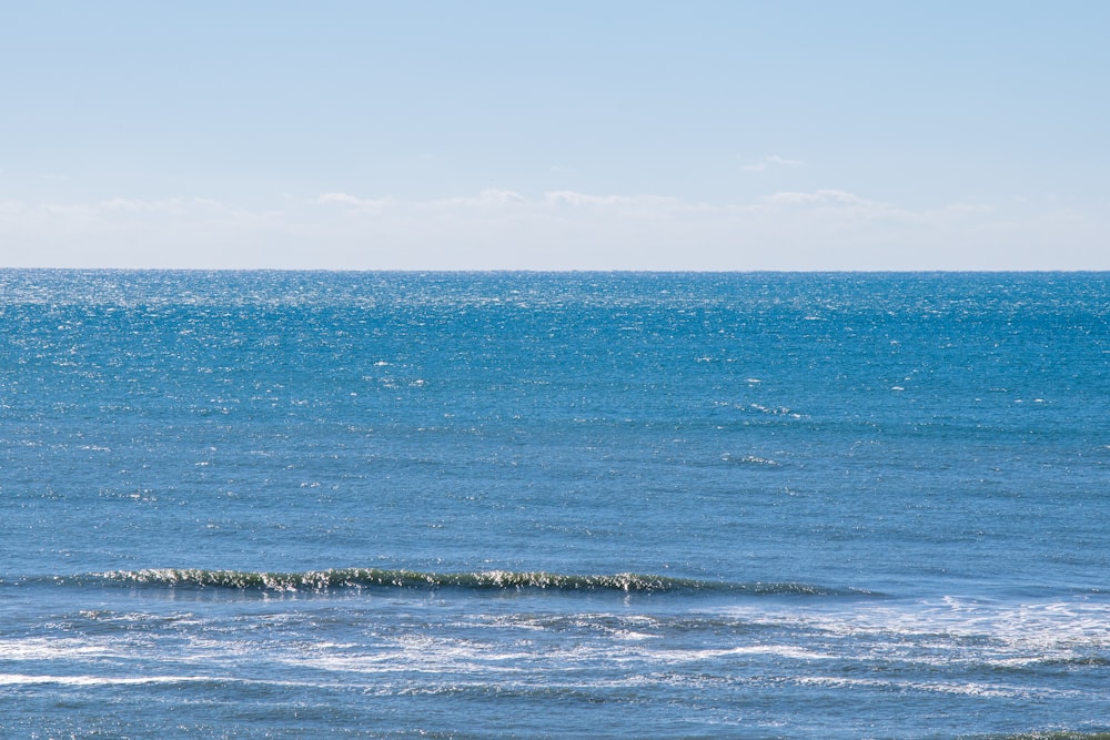 blue sea under blue sky during daytime