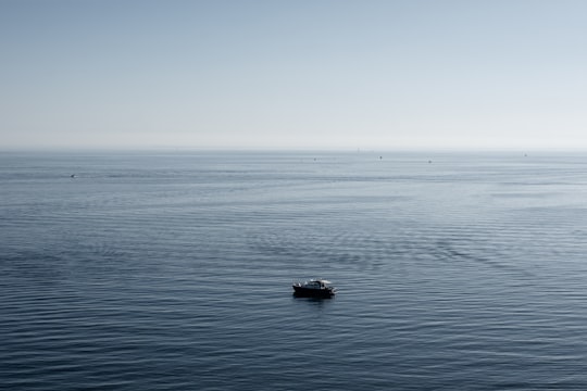 black boat on sea under blue sky during daytime in Black Rock VIC Australia