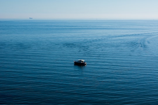 black boat on blue sea during daytime in Black Rock VIC Australia