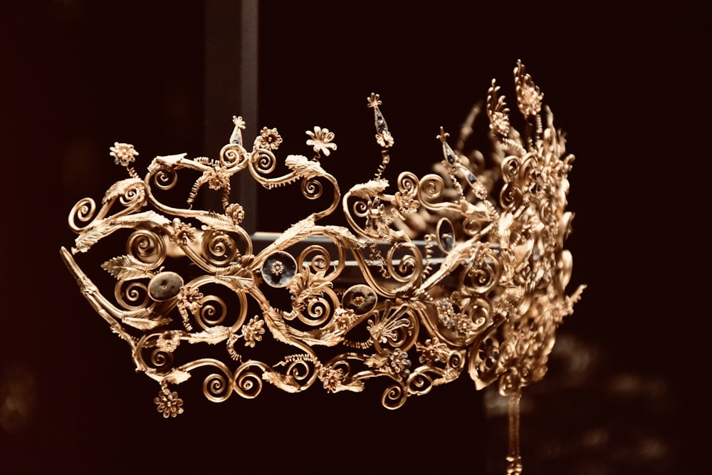 gold floral chandelier turned on in dark room