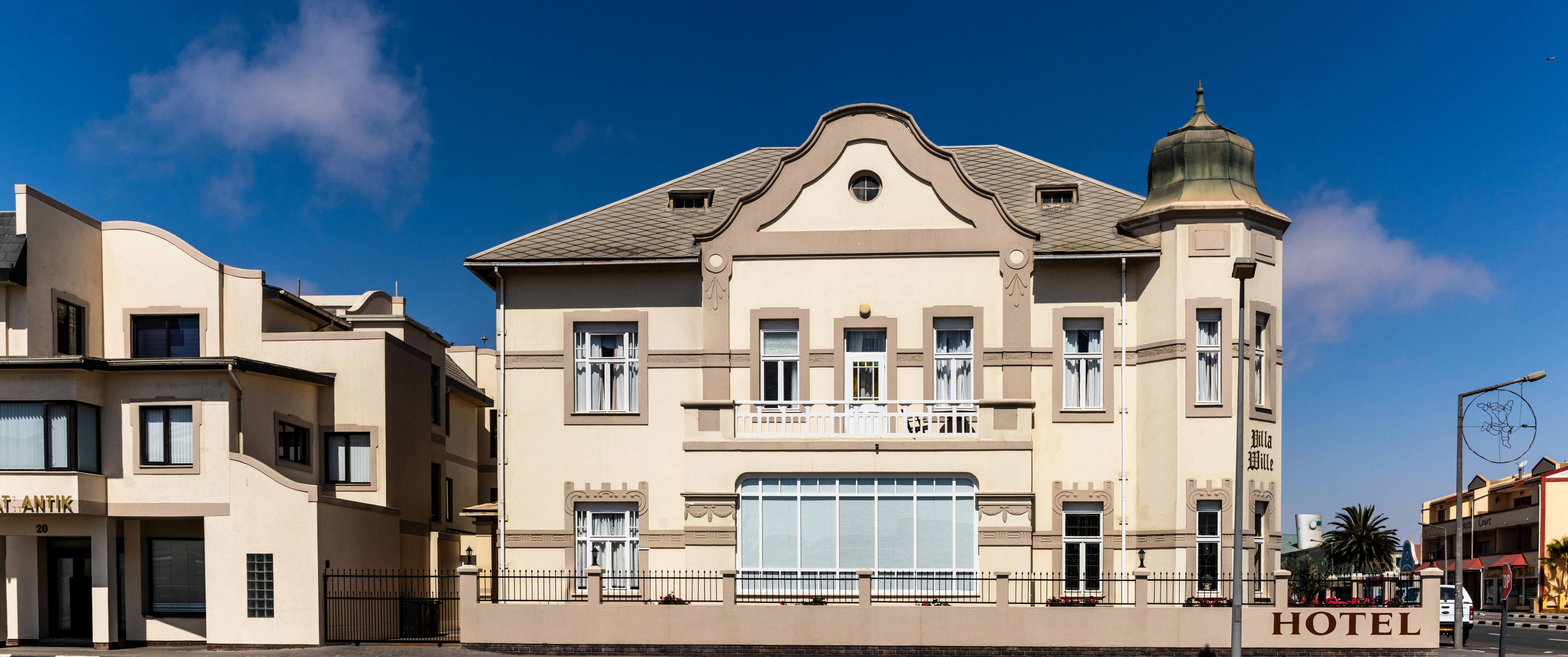 white concrete building under blue sky during daytime
