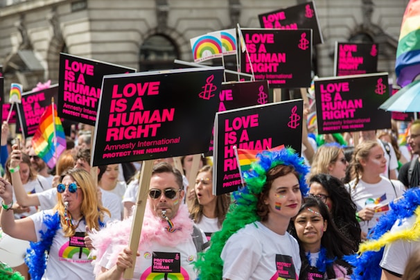 people holding pride banner in demonstration