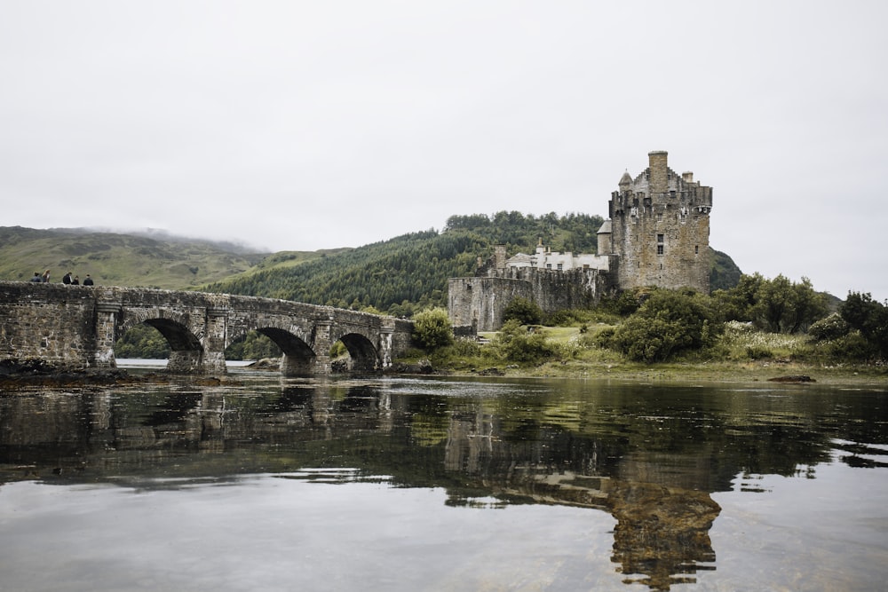 gray concrete bridge over river during daytime