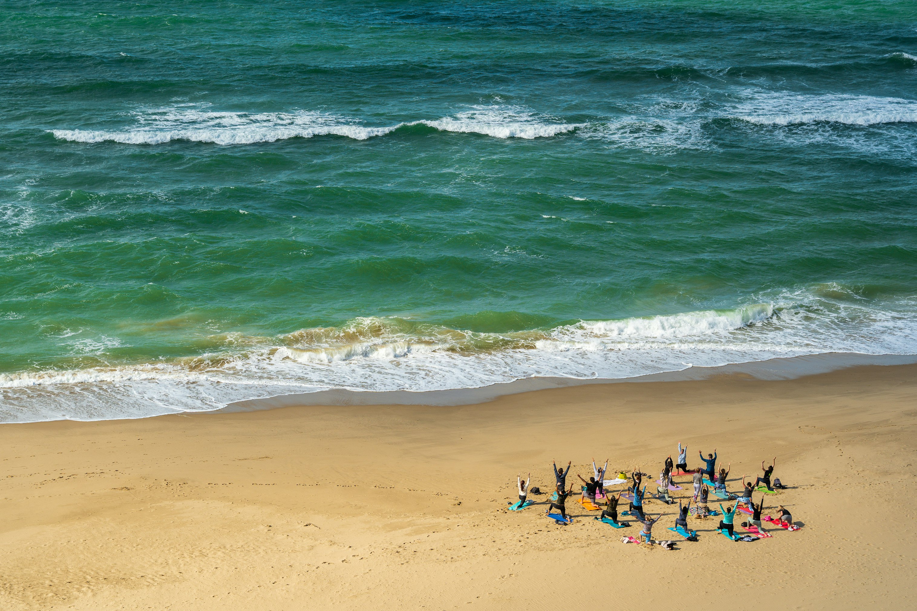 Sunday morning yoga class on the beach in Bournemouth. 