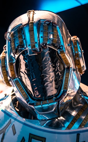 blue and black helmet on blue and white textile