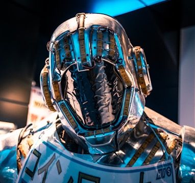 blue and black helmet on blue and white textile