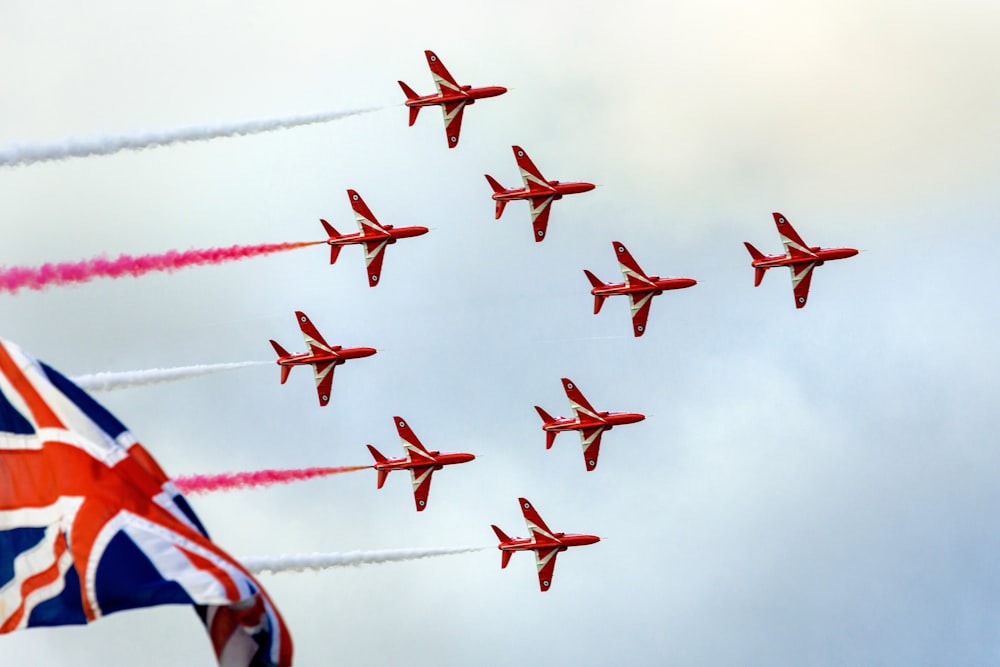 red and white jet plane in the sky