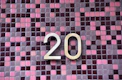 gold letter b on red and black checkered textile