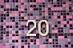 gold letter b on red and black checkered textile