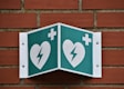 green and white arrow sign
