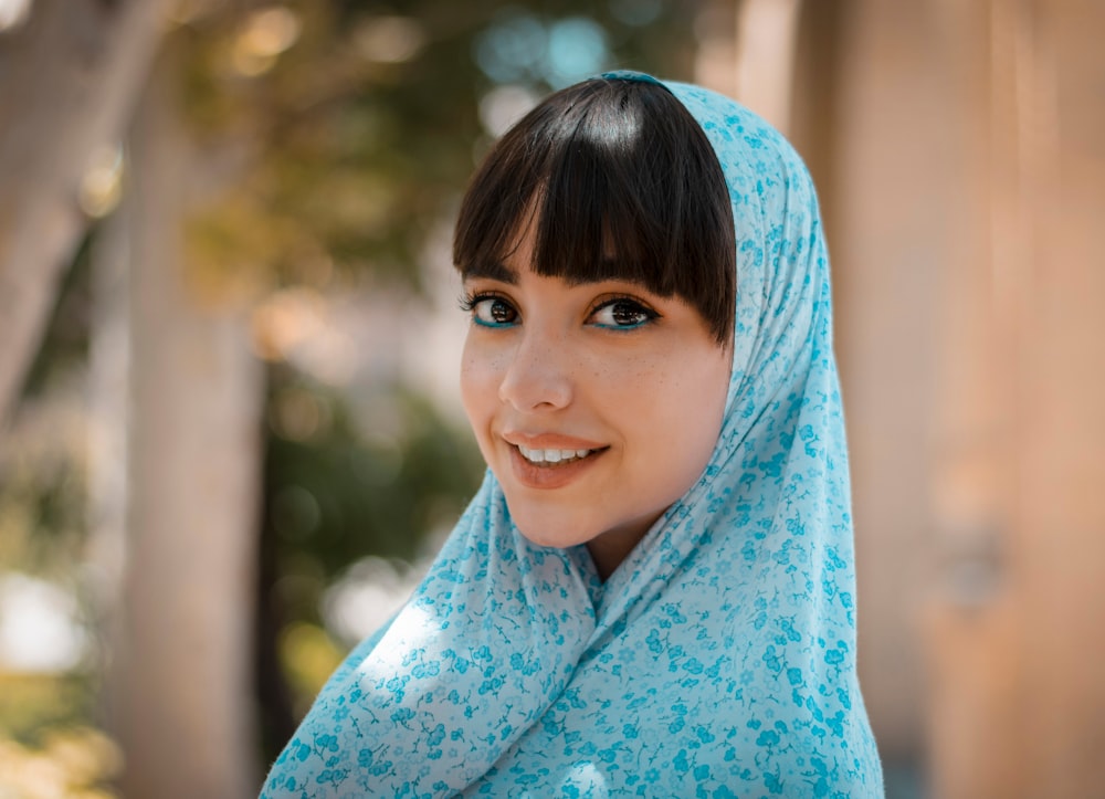 woman in blue and white floral hijab