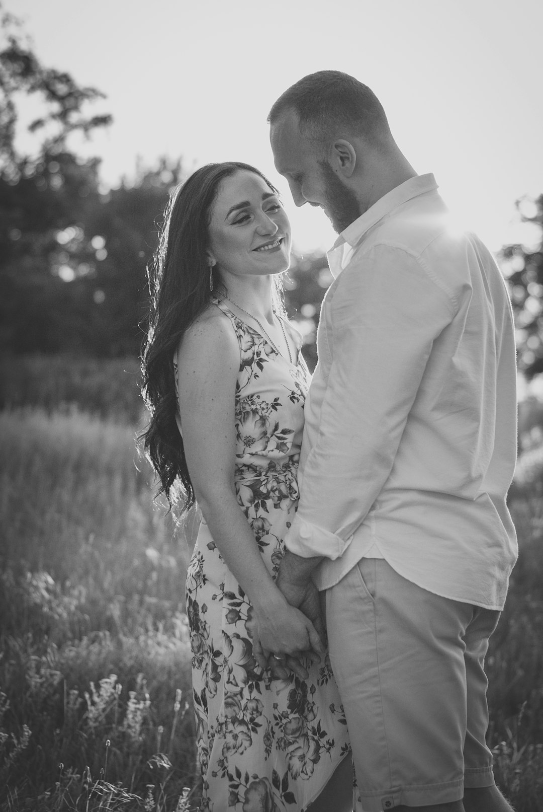 grayscale photo of couple smiling