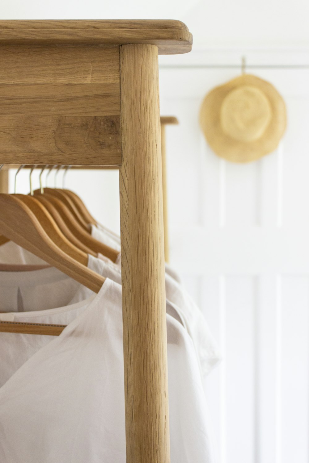 brown wooden bed frame with white bed linen