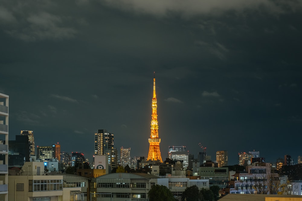 lighted tower in the city during night time