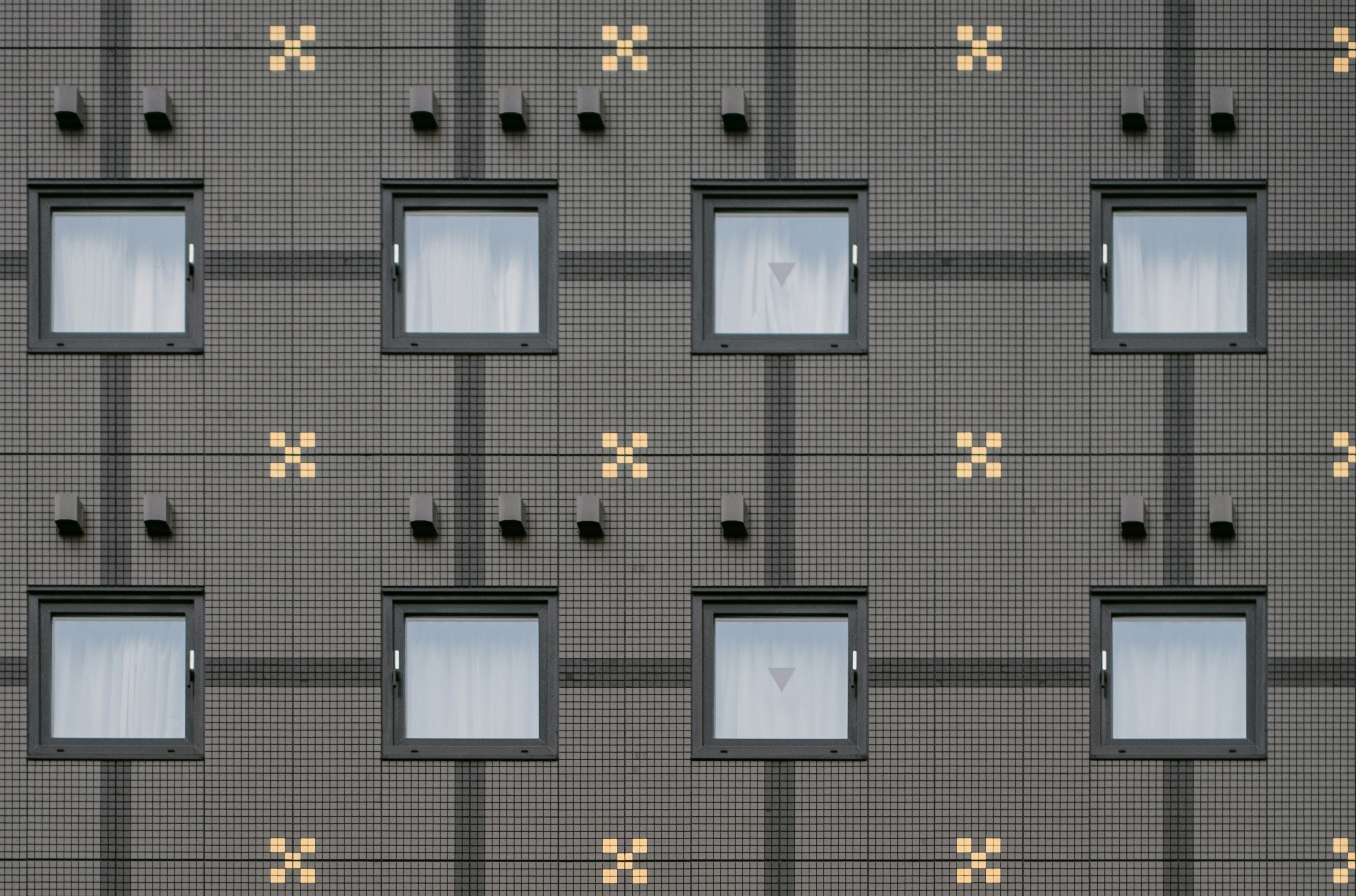 Pixel wall with square window in Tokyo