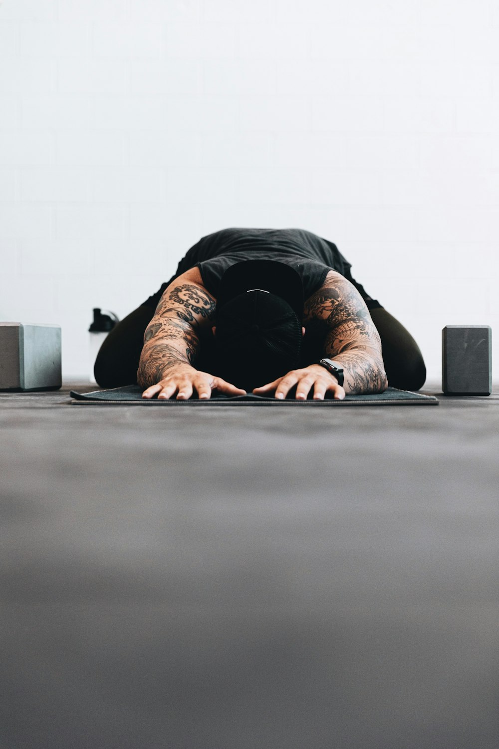 man lying on black bed