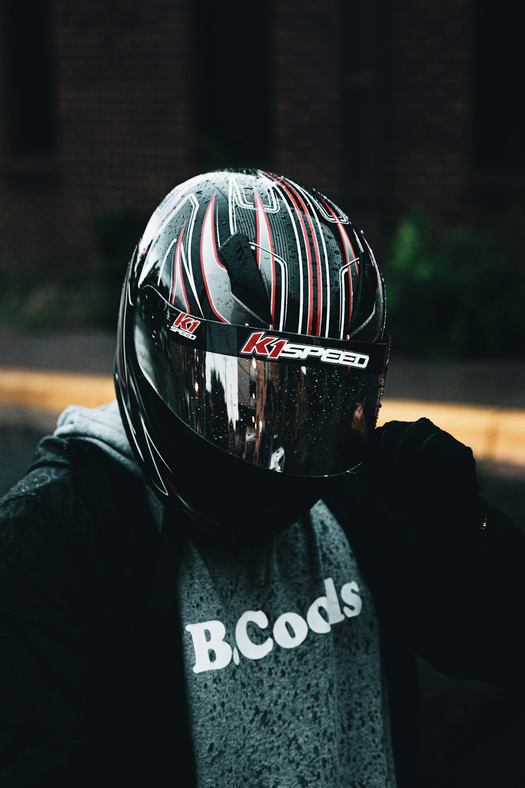 person wearing black and red helmet