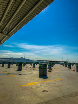 A freshly poured and finished commercial parking lot under bright Panama City sky.