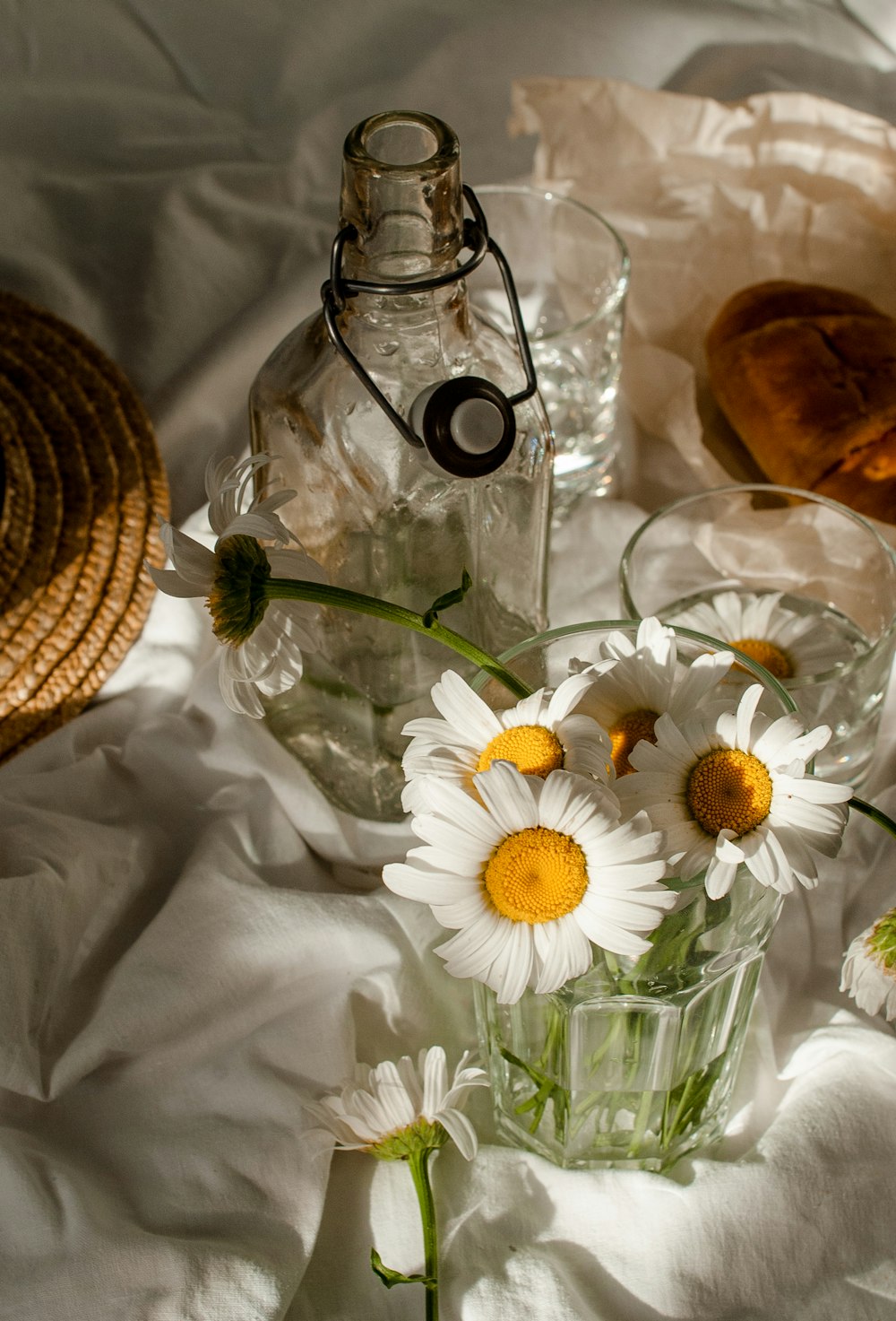 white daisy flowers in clear glass vase