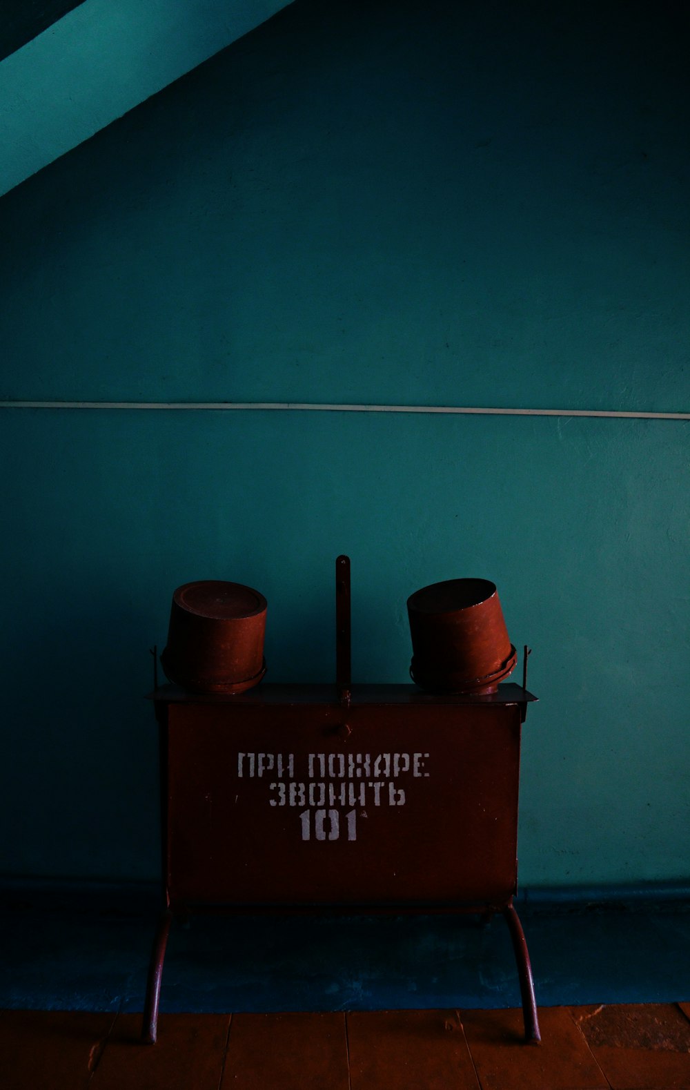 brown metal container on brown wooden box