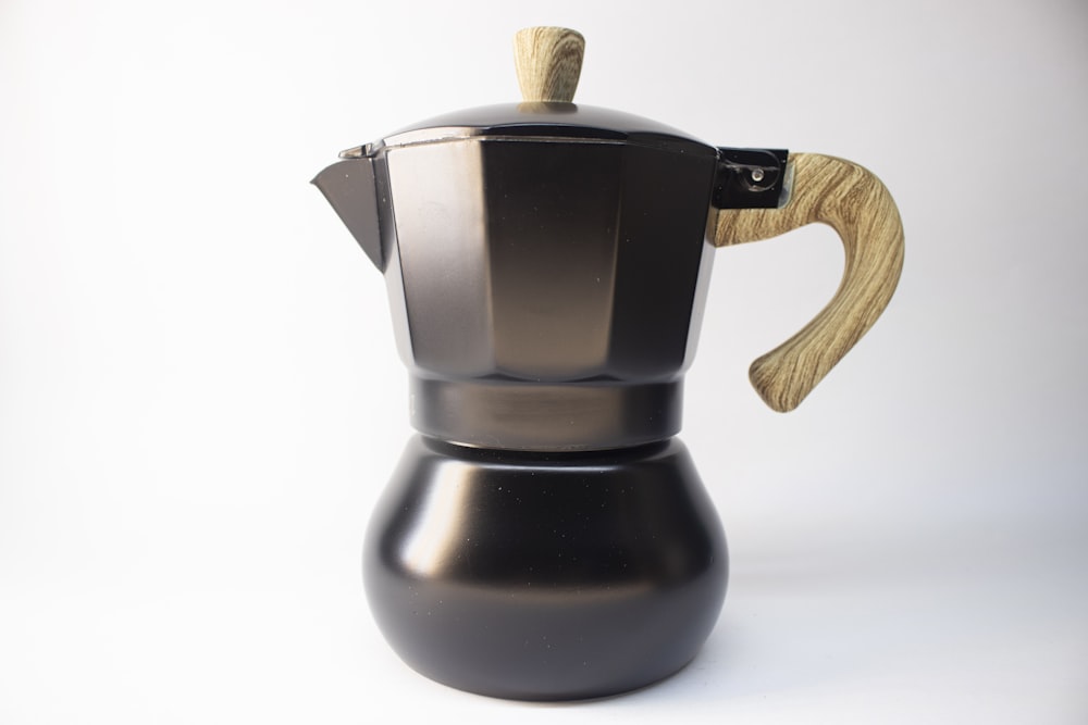 black and silver teapot on white table