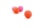 Several small basketball toys are placed on a plain white background. The balls are textured and vary in color, with two being orange and two pink. The focus is on the basketball in the foreground, which is distinctly highlighted.