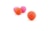 Several small basketball toys are placed on a plain white background. The balls are textured and vary in color, with two being orange and two pink. The focus is on the basketball in the foreground, which is distinctly highlighted.