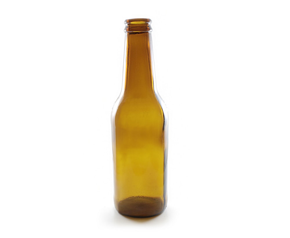 brown glass bottle with white background